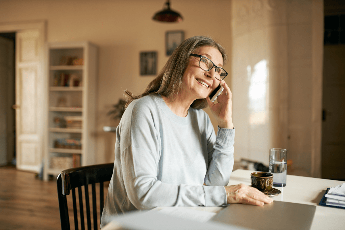 Woman on the phone about wifi network sitting in her house