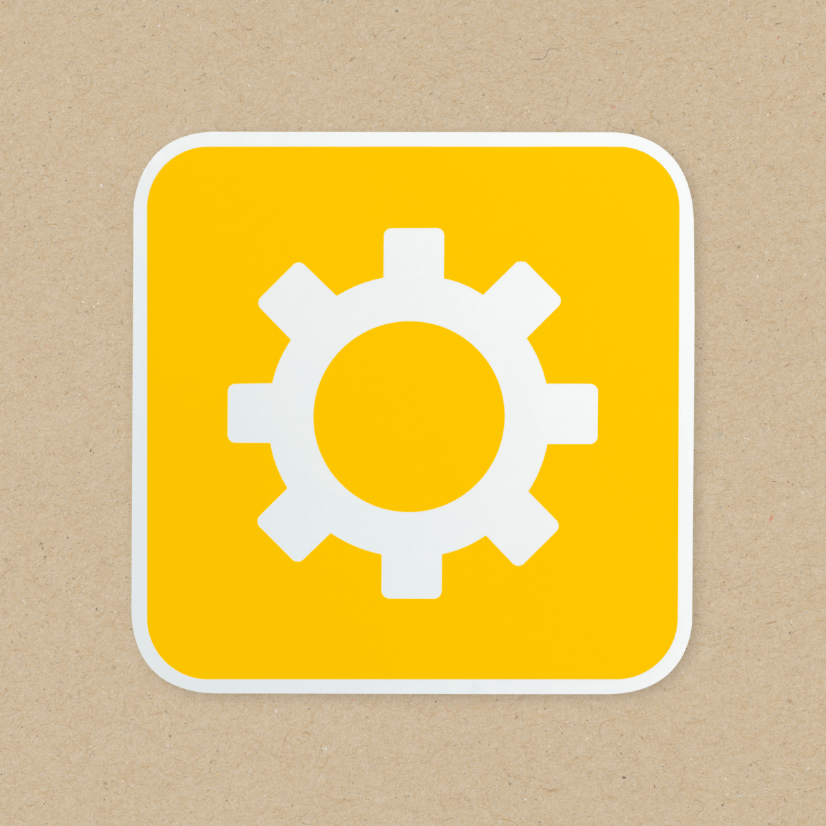 White setting logo on yellow box with brown background